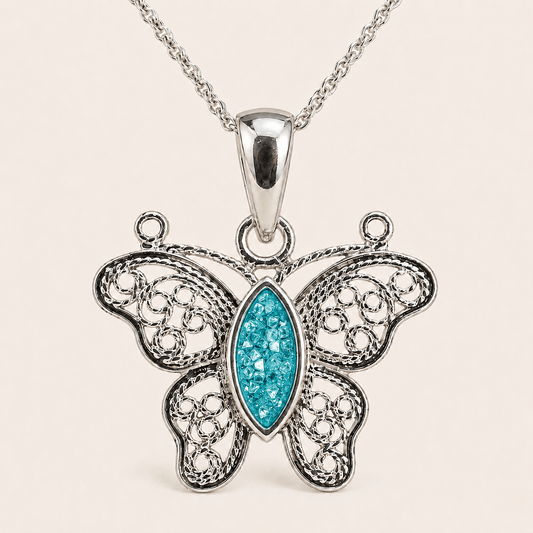 silver butterfly pendant necklace featuring an openwork filigree design
