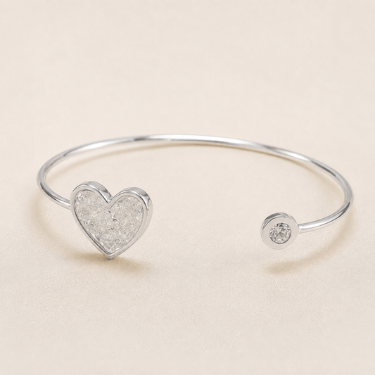 silver open cuff bracelet featuring a heart-shaped crystal cluster