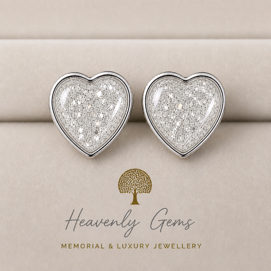 Pair of heart-shaped silver earrings