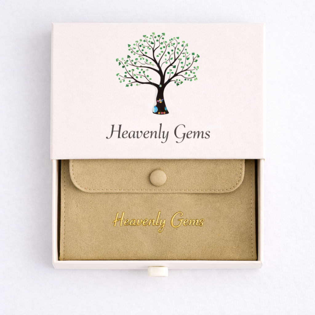 Jewelry box with 'Heavenly Gems' branding and a tree design on the lid.