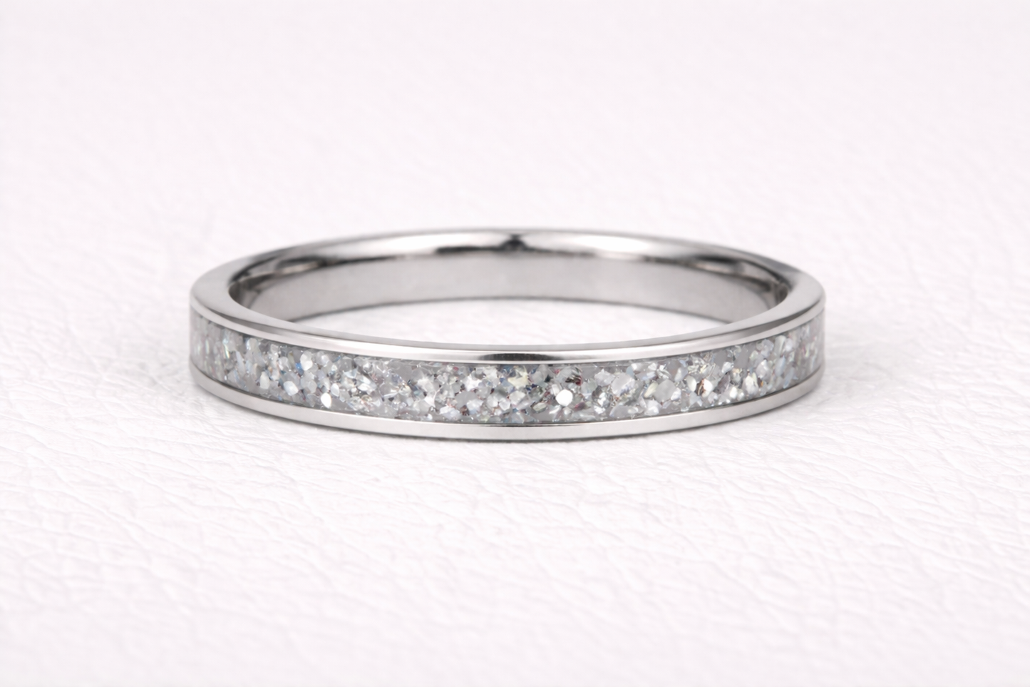 Silver ring with sparkling glitter inlay design