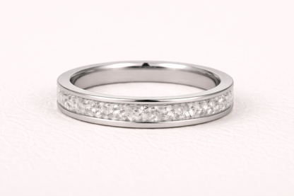 Silver ring with small diamonds on a white background